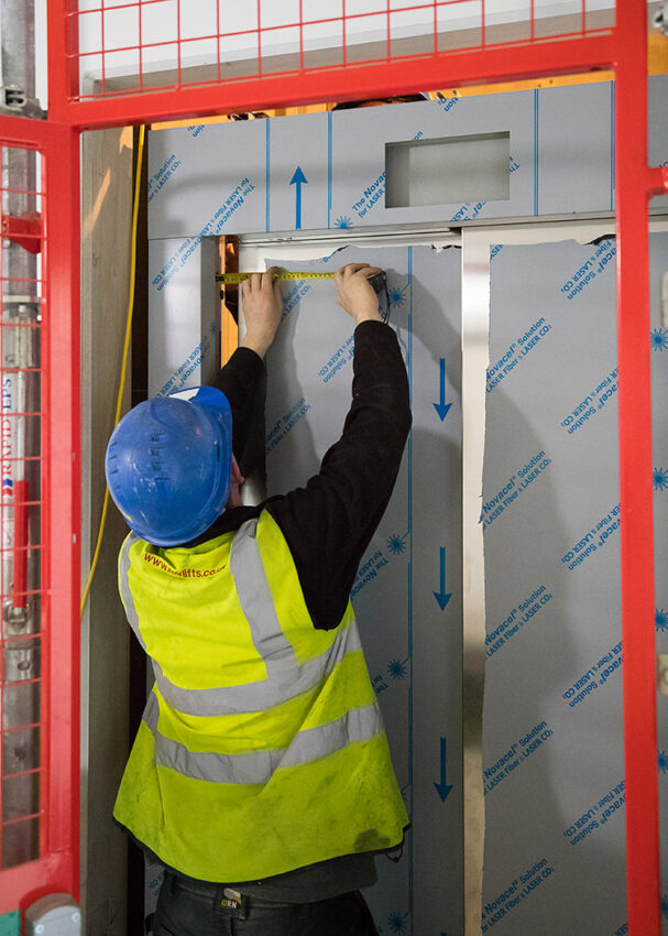 Lift Installation Lincoln Transport Hub for Willmott Dixon, Lift engineer measuring doors