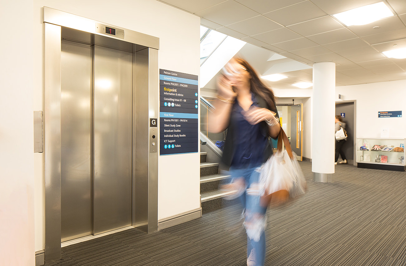 Lift Installation worcester at University of WOrcester Edward Elgar Building, student walking