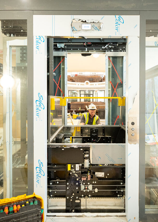 Glass Lift Installation Nottingham Trent University, University Hall, lift engineer at work